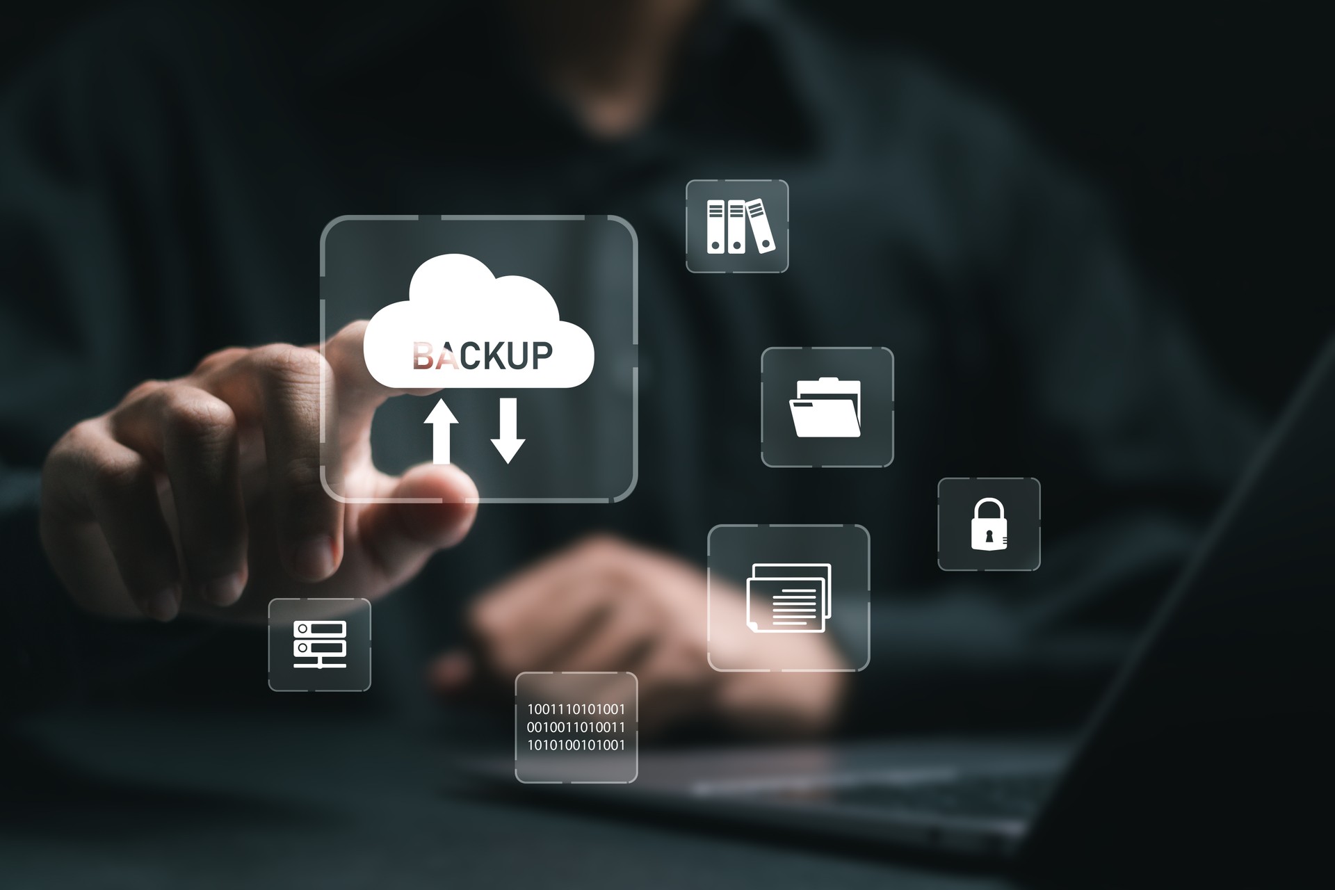 Backup storage data technology concept. businessman use laptop with virtual backup icons for backup online documentation database and digital file storage system or software,file access, doc sharing.